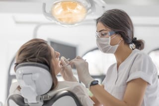 A patient receiving treatment from an orthodontist